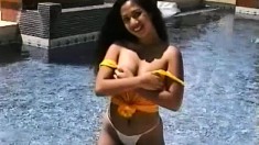 Janice is out by the pool showing her nice ass and boobs before going inside